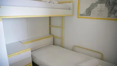 Letto o letti in una camera di Panoramica attic room - Cala Gonone
