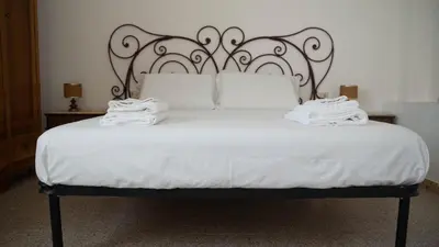 Letto o letti in una camera di Appartamenti Melograno e Fico