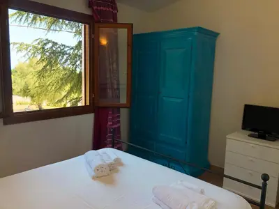 Letto o letti in una camera di Appartamento vista mare Coghe Fae - Ammentos Posada