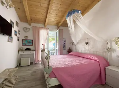 Letto o letti in una camera di La Cuppulata 2 - Stile Romantico