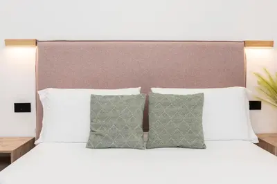 Letto o letti in una camera di NG Guest House il Gallura