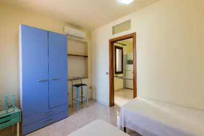 Letto o letti in una camera di Holiday House Olbia Downtown (giardino e ingresso indipendente)