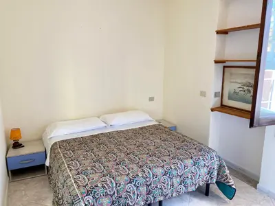 Letto o letti in una camera di Holiday House Olbia Downtown (giardino e ingresso indipendente)