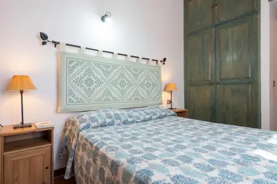 Letto o letti in una camera di Villino Tavolara a San Teodoro