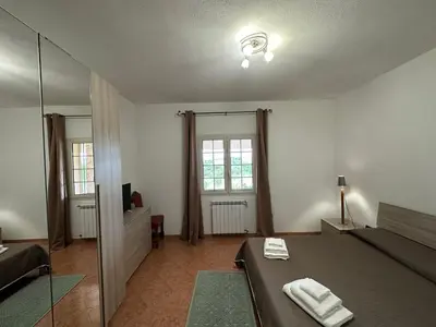 Letto o letti in una camera di Domo Mia