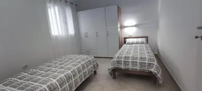Letto o letti in una camera di DOLCE CASA Baïa Sant'Anna - Budoni