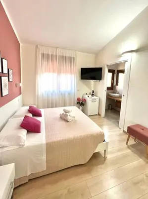 Letto o letti in una camera di InCentro - San Teodoro