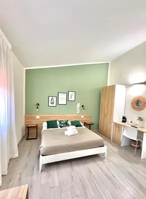 Letto o letti in una camera di InCentro - San Teodoro