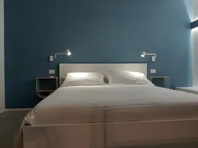 Letto o letti in una camera di Kore Home