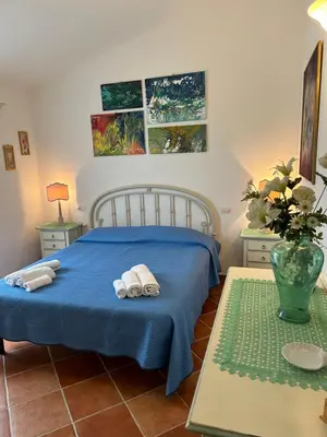 Letto o letti in una camera di ROSA DEI VENTI - CASA MAESTRALE - Sardegna - IUN R2217