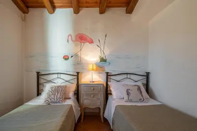 Letto o letti in una camera di Villetta Erica