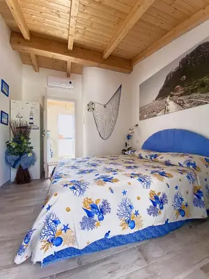 Letto o letti in una camera di La Cuppulata 2 - Stile Mare
