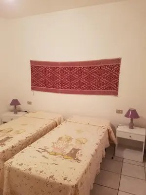 Letto o letti in una camera di San Teodoro centro