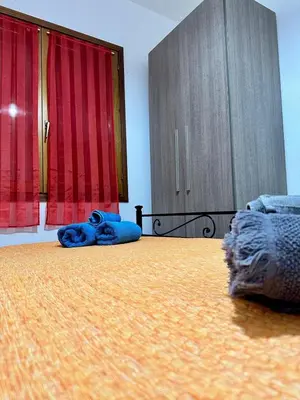 Letto o letti in una camera di San Teodoro centro