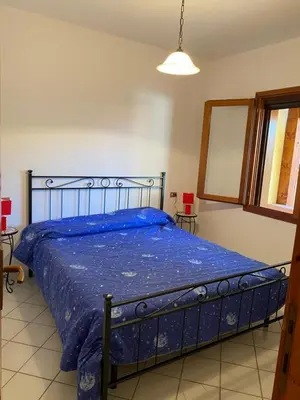 Letto o letti in una camera di San Teodoro centro
