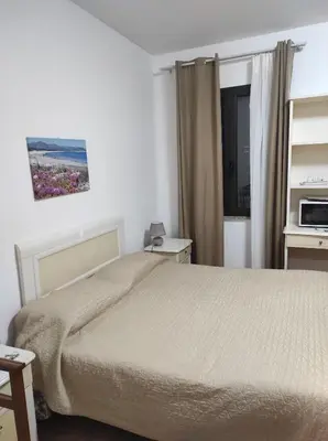 Letto o letti in una camera di MONOLOCALE YELLOW