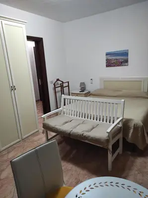 Letto o letti in una camera di MONOLOCALE YELLOW