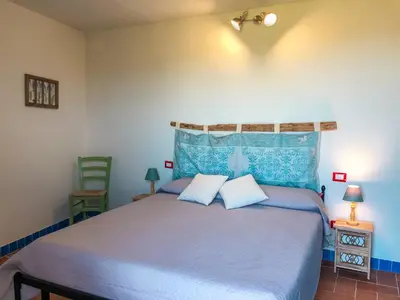 Letto o letti in una camera di panoramic LOFT Fora e ' Muros with sea view common terrace , Ammentos Posada