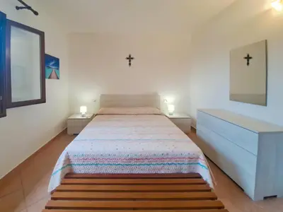 Letto o letti in una camera di Appartamento Residenziale Trilocale 4 posti letto Stella Marina