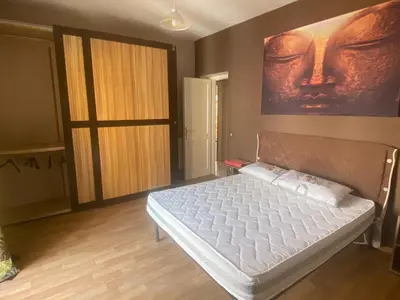 Letto o letti in una camera di Gerani Quadrilocale