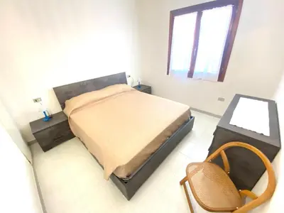 Letto o letti in una camera di Villino L'isuledda