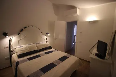 Letto o letti in una camera di EFFE Apartment Golfo Aranci: Sole, Mare e Relax