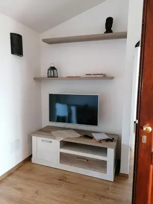 TV o dispositivi per l'intrattenimento presso EFFE Apartment Golfo Aranci: Sole, Mare e Relax