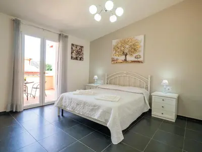 Letto o letti in una camera di SweetHome - MORADA