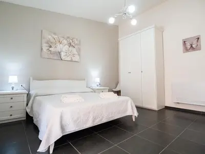 Letto o letti in una camera di SweetHome - MORADA