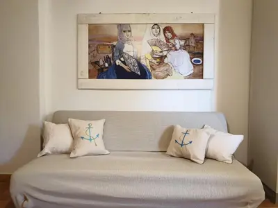 Letto o letti in una camera di Capo Figari 9, Appartamento spazioso nel centro di Golfo Aranci con terrazza, Wi-Fi, parcheggio gratuito