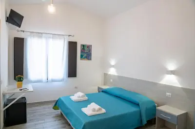 Letto o letti in una camera di Affittacamere Su Portzu
