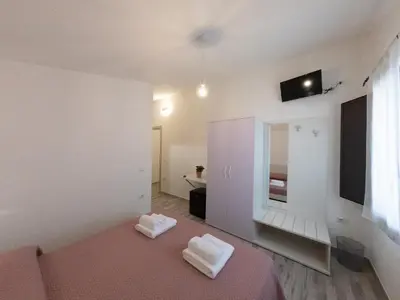 Letto o letti in una camera di Affittacamere Su Portzu
