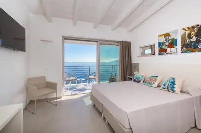 Letto o letti in una camera di Hotel Caramare