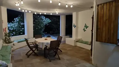 Area soggiorno di Le Farfalle Appartamento in villa trifamiliare