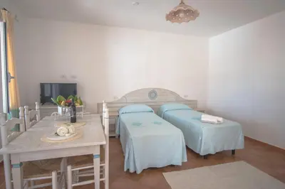 Letto o letti in una camera di Le Residenze del Golfo di Orosei