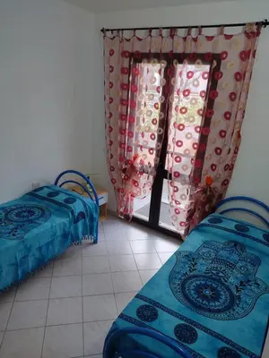 Letto o letti in una camera di Appartamento a La Caletta