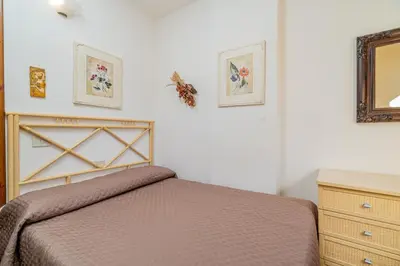 Letto o letti in una camera di Porto San Paolo Apartments