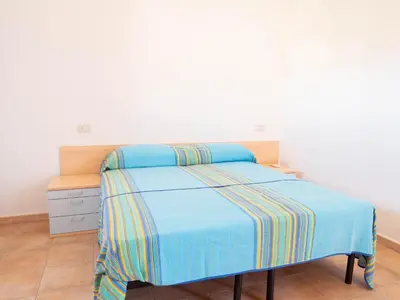Letto o letti in una camera di Villetta spiaggia a piedi BudoniAffitti