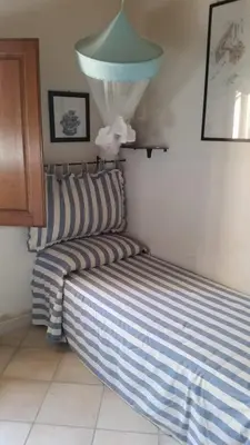 Letto o letti in una camera di La casa di Camilla a Punta Molara