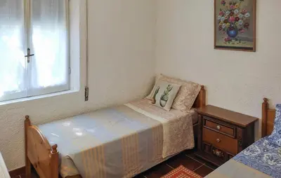 Letto o letti in una camera di Cozy Home In Orgosolo