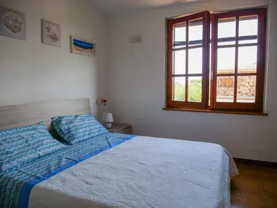 Letto o letti in una camera di grandi famiglie o comitive 150 mt spiaggia budoni affitti