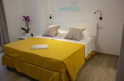 Letto o letti in una camera di Affittacamere Mariposa
