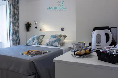 Letto o letti in una camera di Affittacamere Mariposa