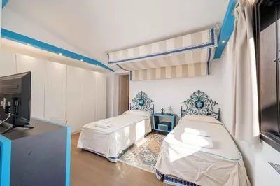 Letto o letti in una camera di Villa Puntaldia