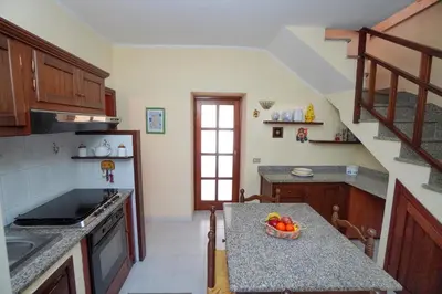 Cucina o angolo cottura di Le Case di Mara - Monte Petrosu House
