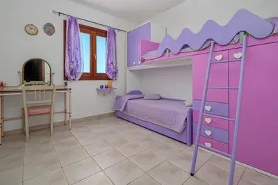 Letto o letti in una camera di Villetta Lutturai