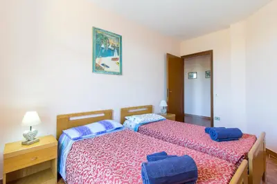 Letto o letti in una camera di Appartamenti in Villa con ampio giardino esterno