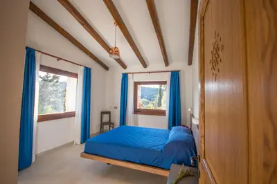 Letto o letti in una camera di Corbezzolo (Villa Capelvenere)