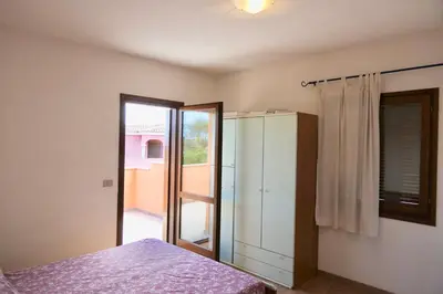 Letto o letti in una camera di ISS Travel, La Ginestra - 2-bedroom apartment with terrace and view over Tavolara Island
