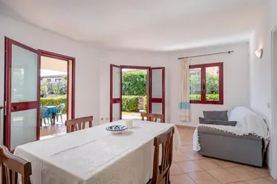 Area soggiorno di Apartments in Residence with swimming pool in Cala Girgolu